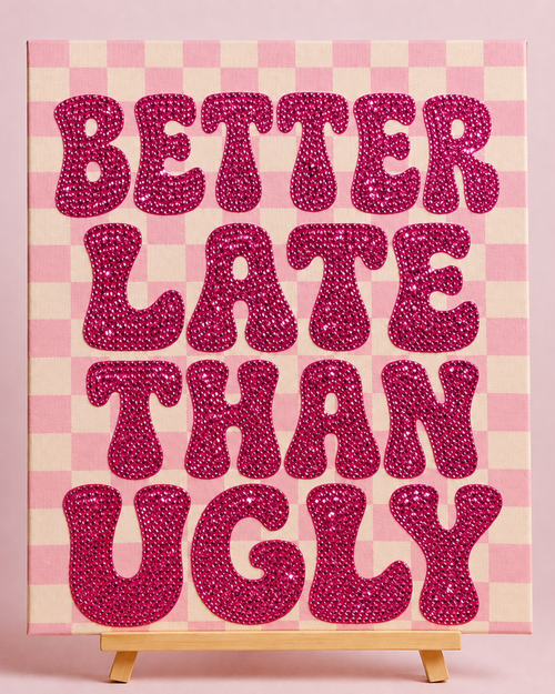 Finished Better Late Than Ugly pink rhinestone canvas on a wooden easel