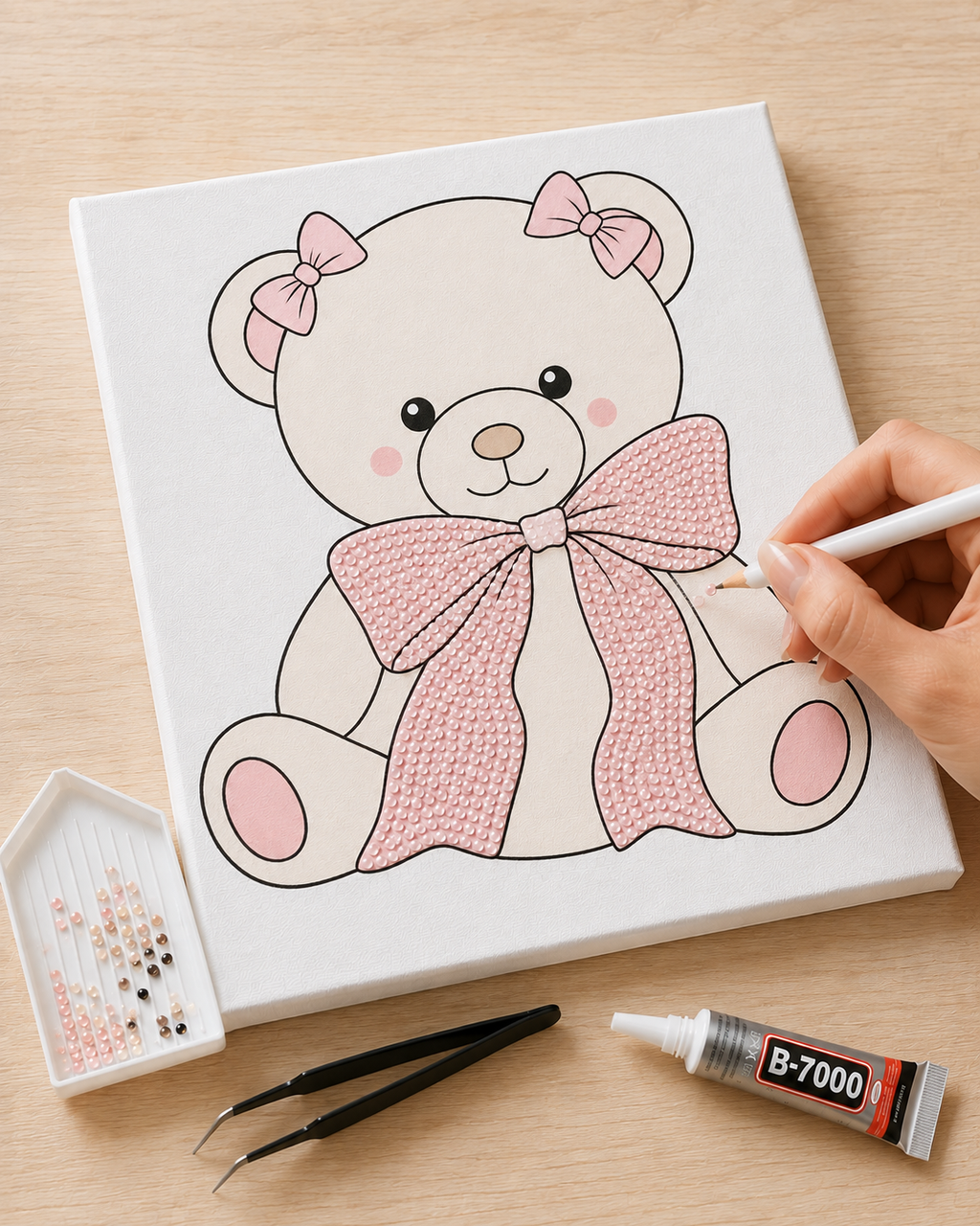 Bow Bear DIY bedazzle canvas kit being decorated with colour-matched rhinestones and B-7000 glue