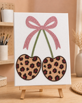 Finished Cherry Cheetah rhinestone canvas displayed on a wooden easel