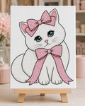 Finished Coquette Kitty rhinestone canvas displayed on a wooden easel