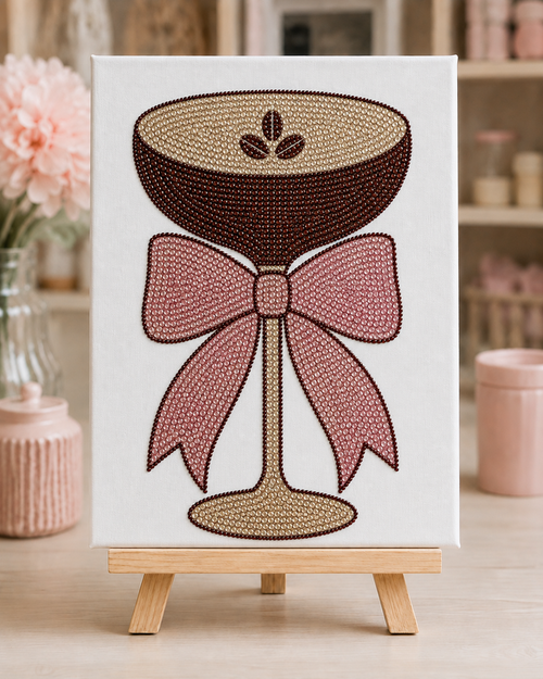 Finished Espresso Martini rhinestone canvas with satin bow displayed on a small wooden easel