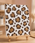 Completed Leopard Print bedazzled canvas displayed in a cosy room