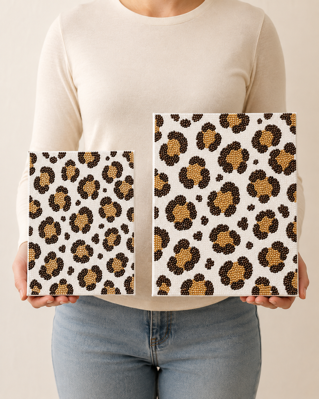 Woman holding Standard 8 x 10 and Large 11 x 14 Leopard Print canvases