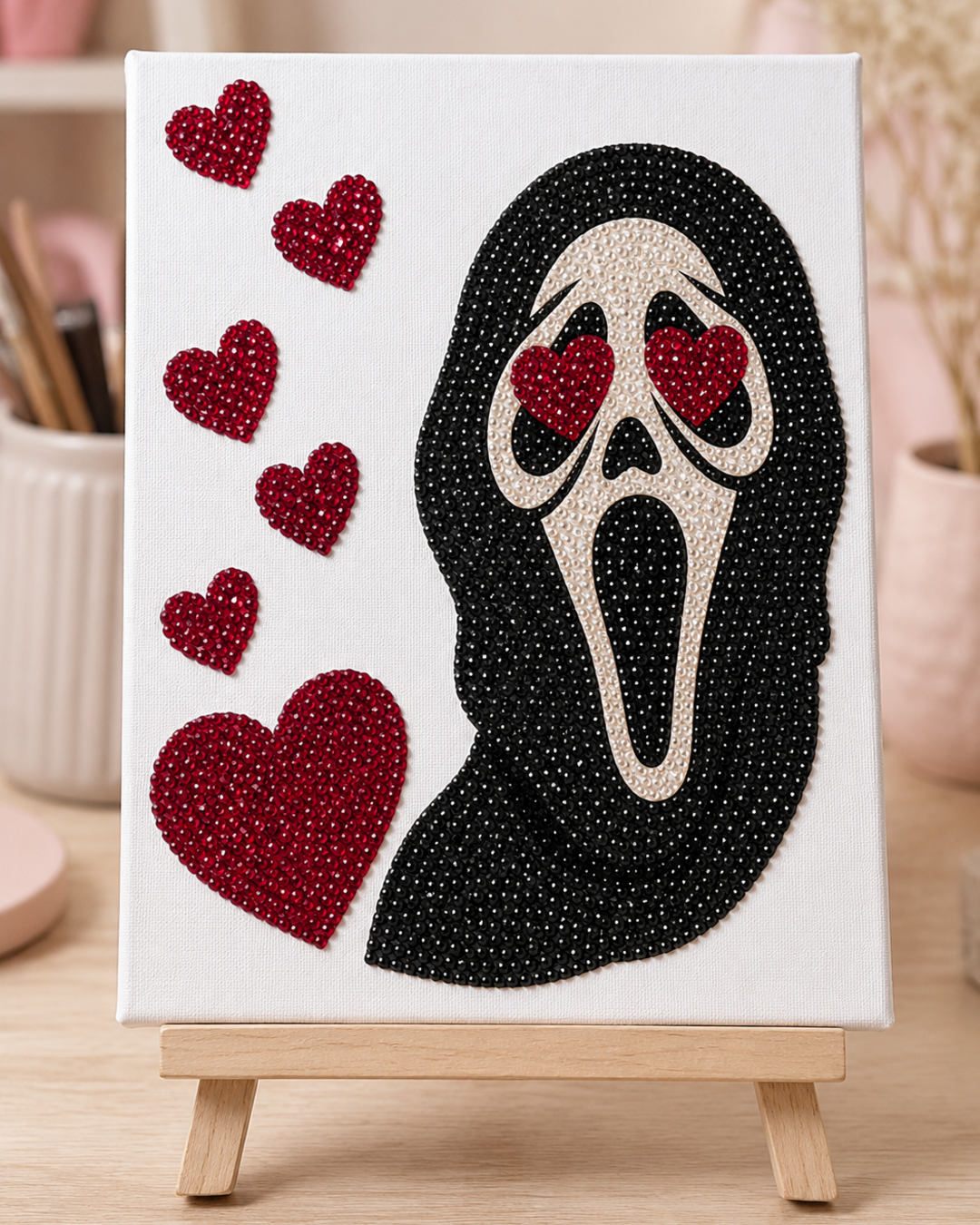 Finished Mask In Love rhinestone canvas displayed on a wooden easel