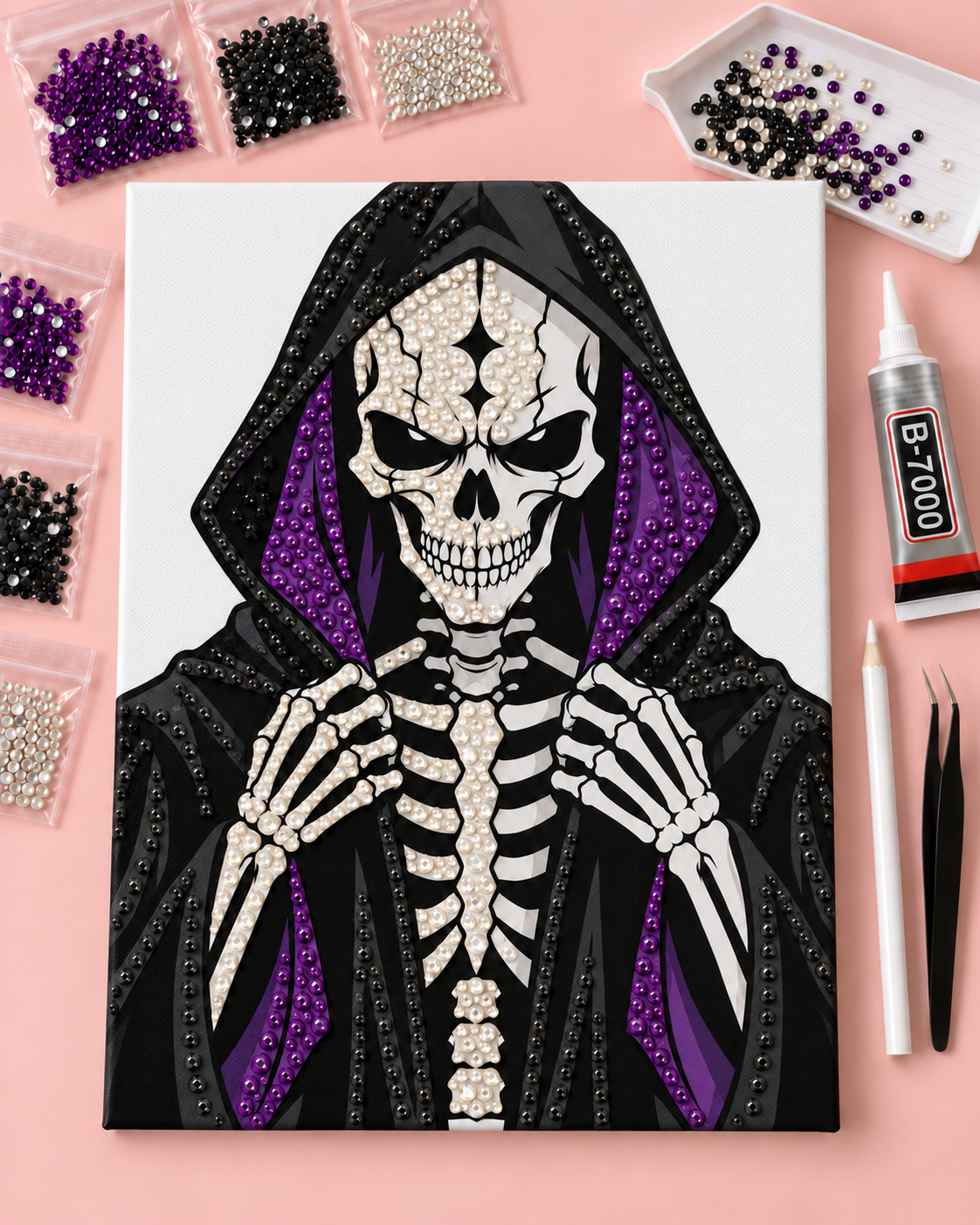 Midnight Reaper skeleton canvas in progress with round rhinestones, B-7000 glue and included tools