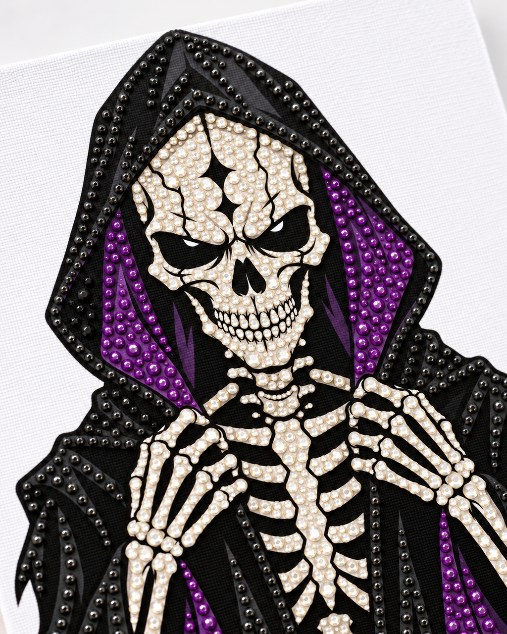 Close-up of round black purple and crystal rhinestones on the Midnight Reaper Halloween canvas