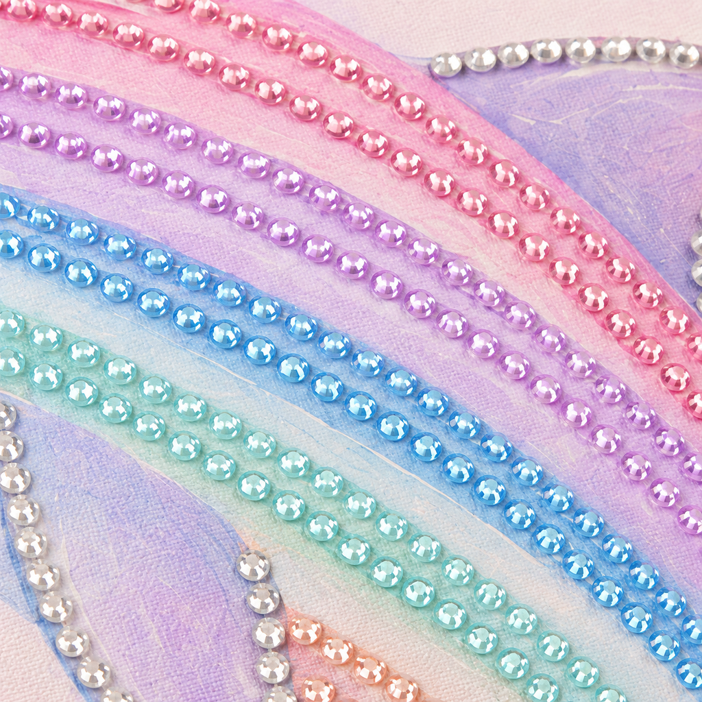 Close up of pastel dolphin rhinestone rows on canvas