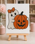 Fully bedazzled Pumpkin Boo ghost and pumpkin canvas kit on a wooden easel