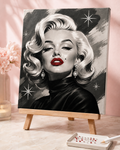 Finished Ruby Icon DIY bedazzle canvas with red rhinestone lips, crystal details and a sharpened white wax pencil