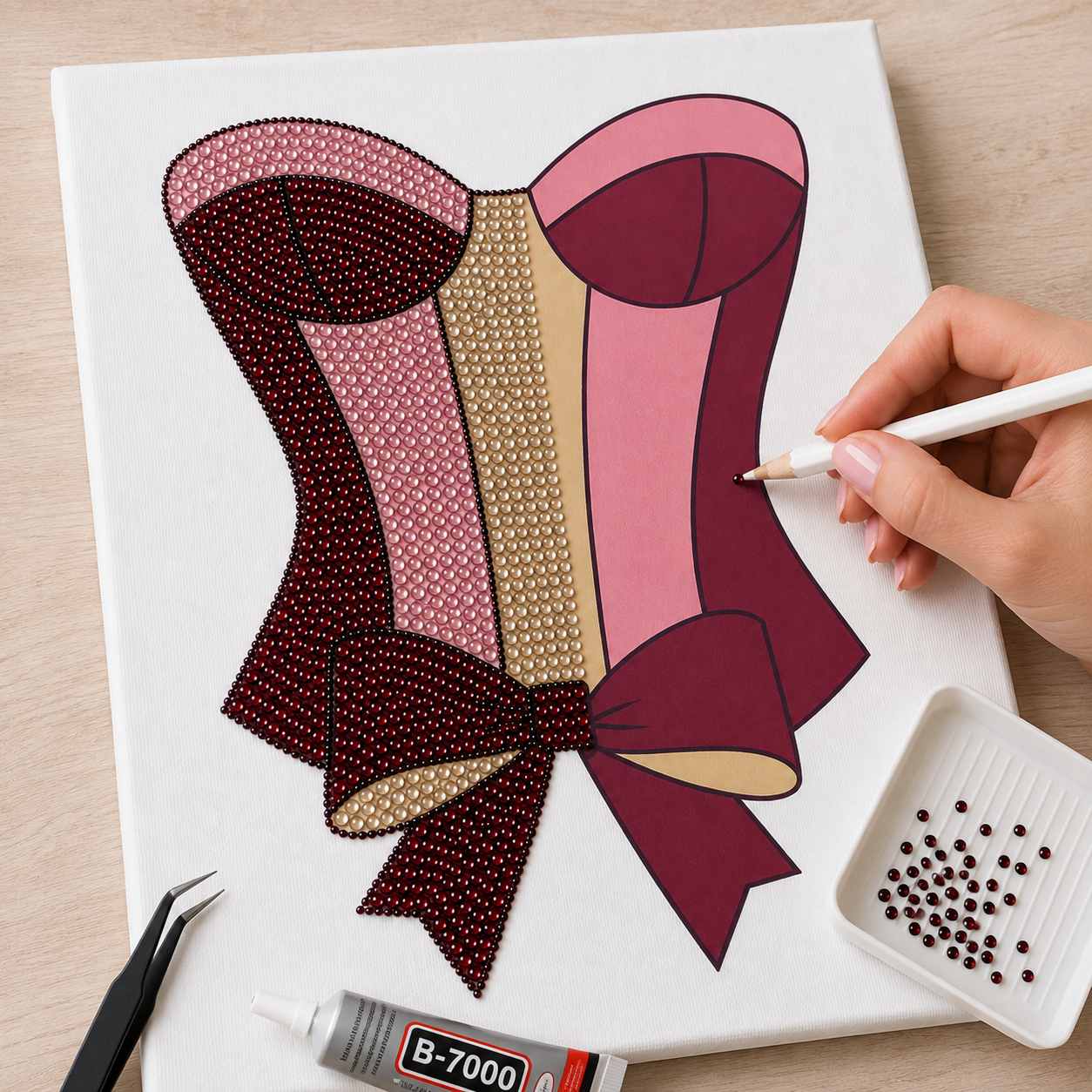 Satin Corset canvas half completed with burgundy, blush and champagne rhinestones