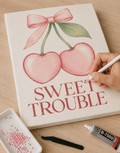 Sweet Trouble DIY bedazzle canvas kit in progress