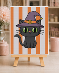 Fully bedazzled Witch Cat Halloween DIY canvas kit on a wooden easel
