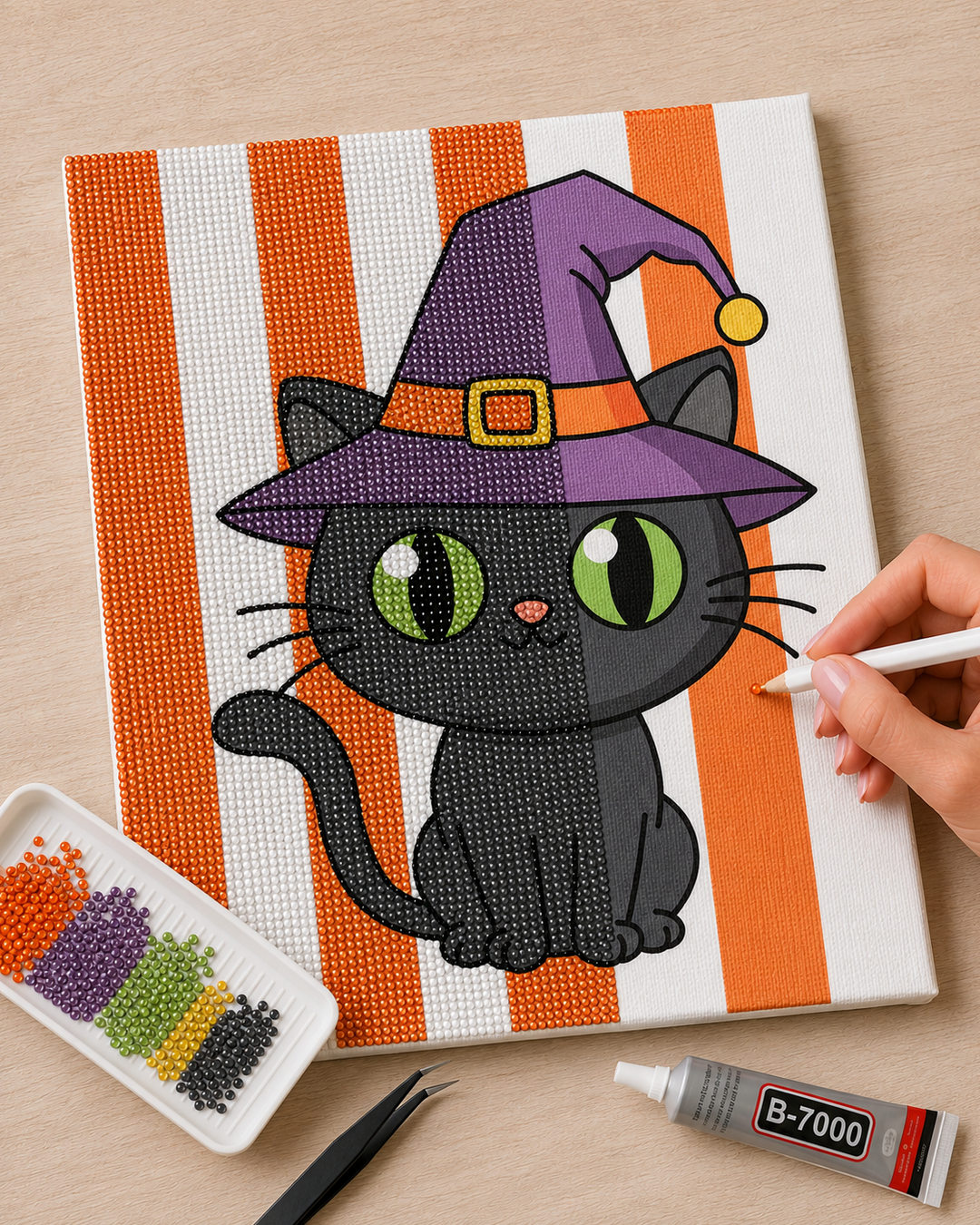 Witch Cat Halloween rhinestone canvas kit in progress with bedazzling tools