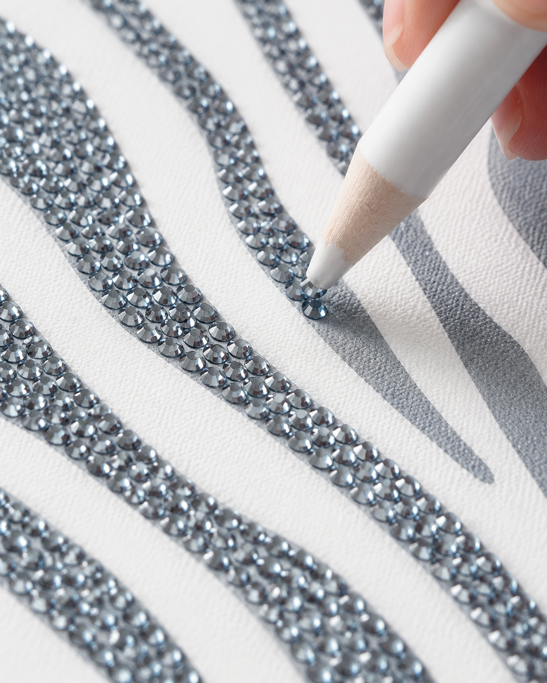 Close-up of blue-grey and silver rhinestones on the Zebra Print canvas