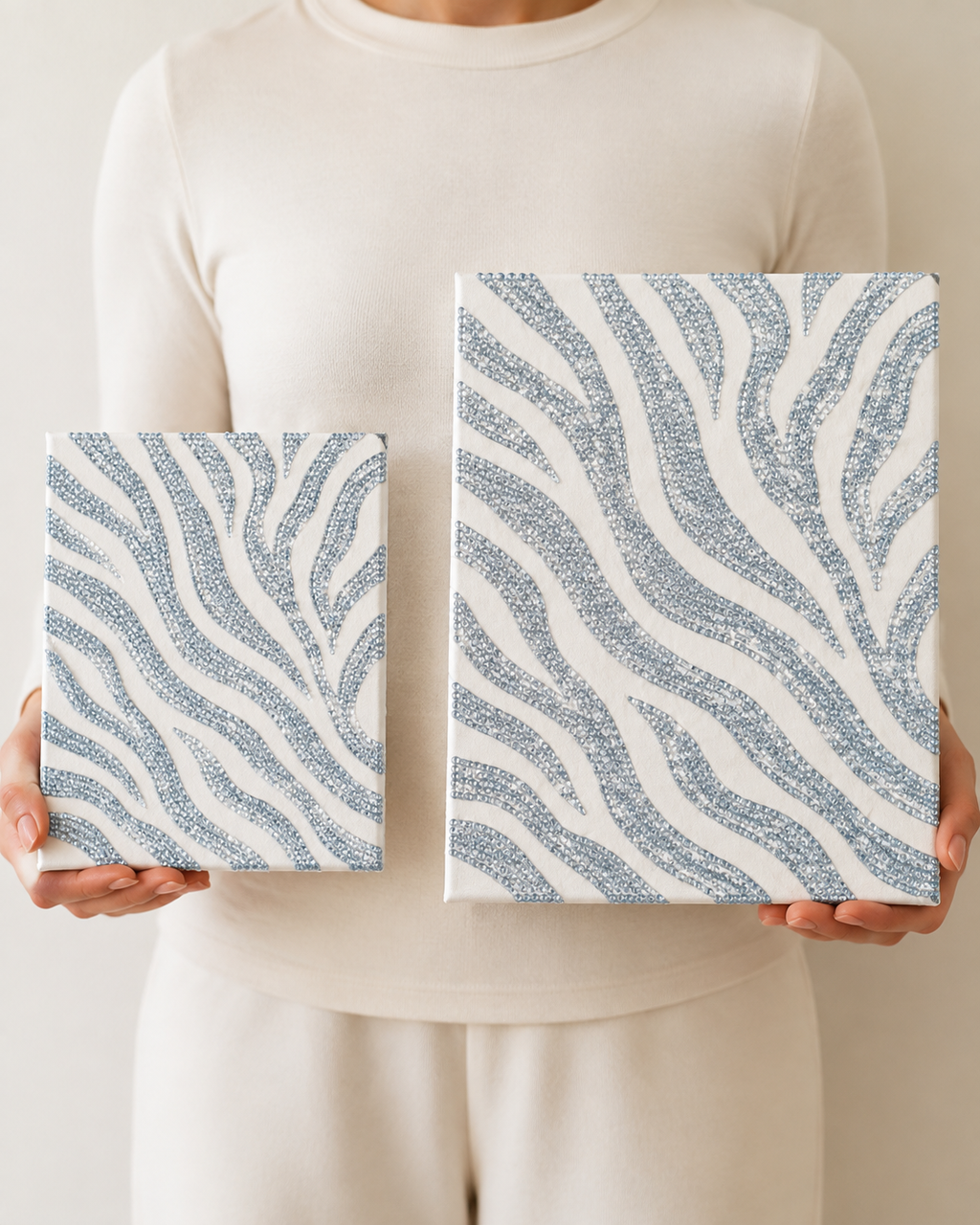 Woman holding Standard 8 x 10 and Large 11 x 14 Zebra Print canvases